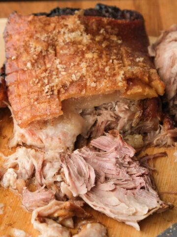 Beer braised pork shoulder pulled apart with crispy golden crackling on top