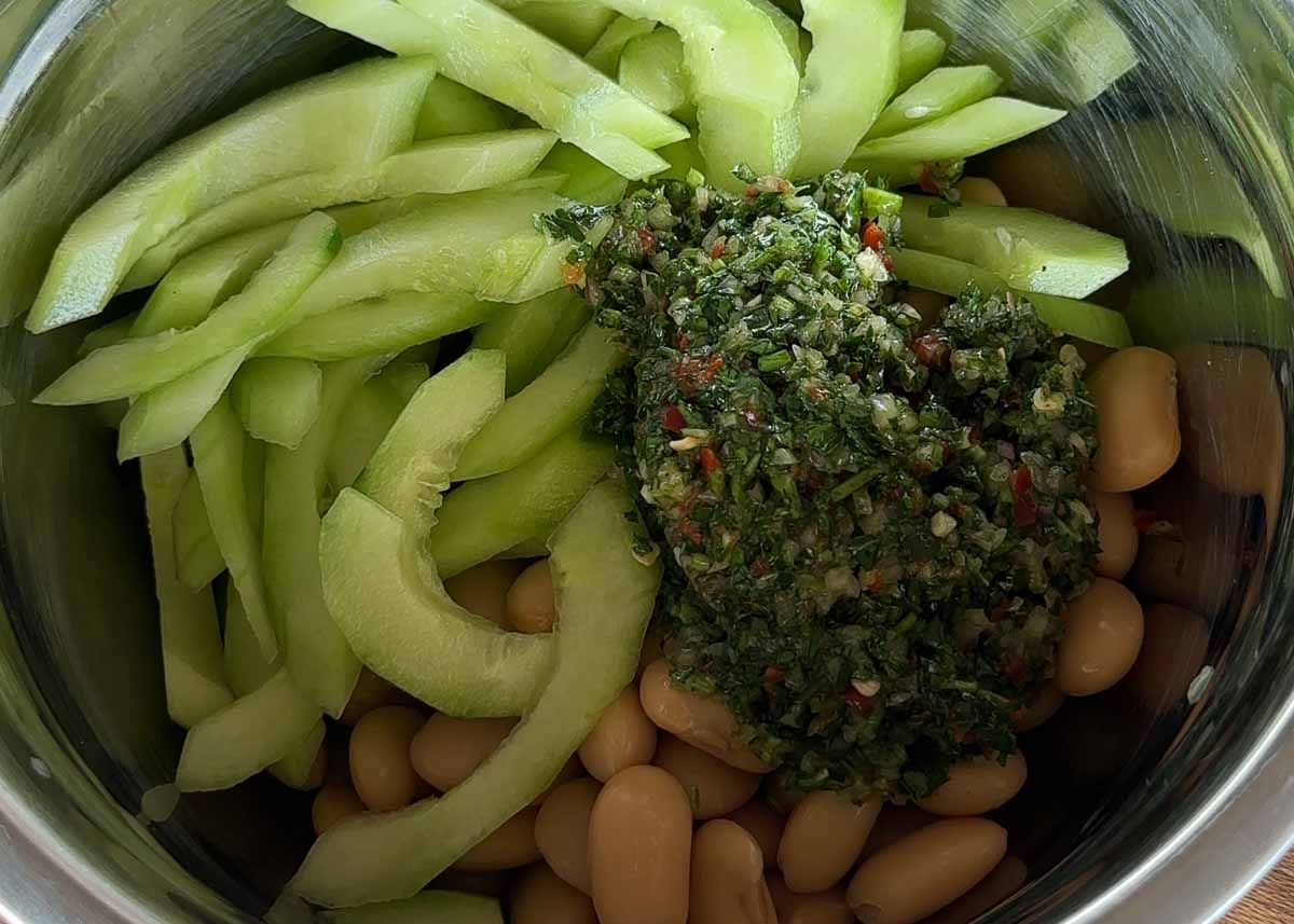 Butter beans and sliced cucumber mixed with chimichurri dressing