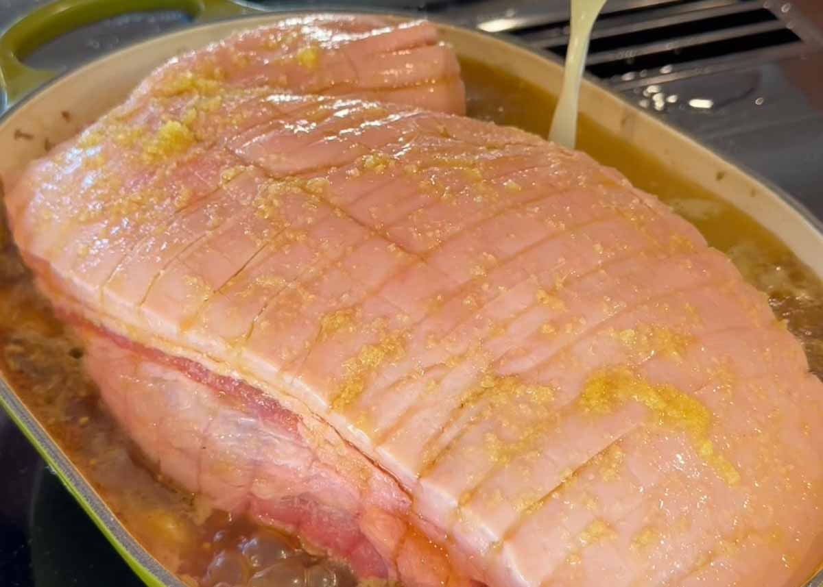Scored pork shoulder skin prepared for crispy crackling before slow cooking