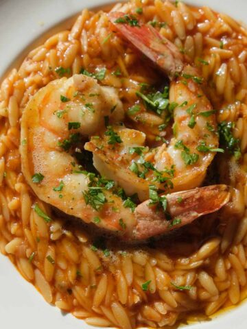 Golden saffron king prawn orzo with garlic, lemon and herbs