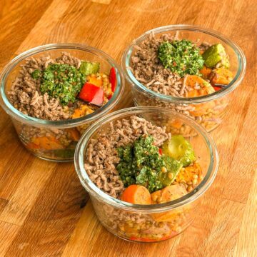 Close-up of beef mince bowl with roasted vegetables, lentils and fresh chimichurri feature image