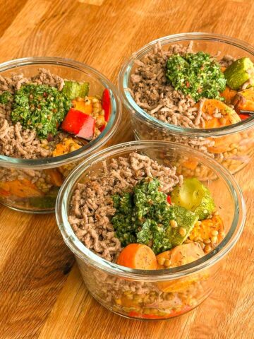 Close-up of beef mince bowl with roasted vegetables, lentils and fresh chimichurri feature image