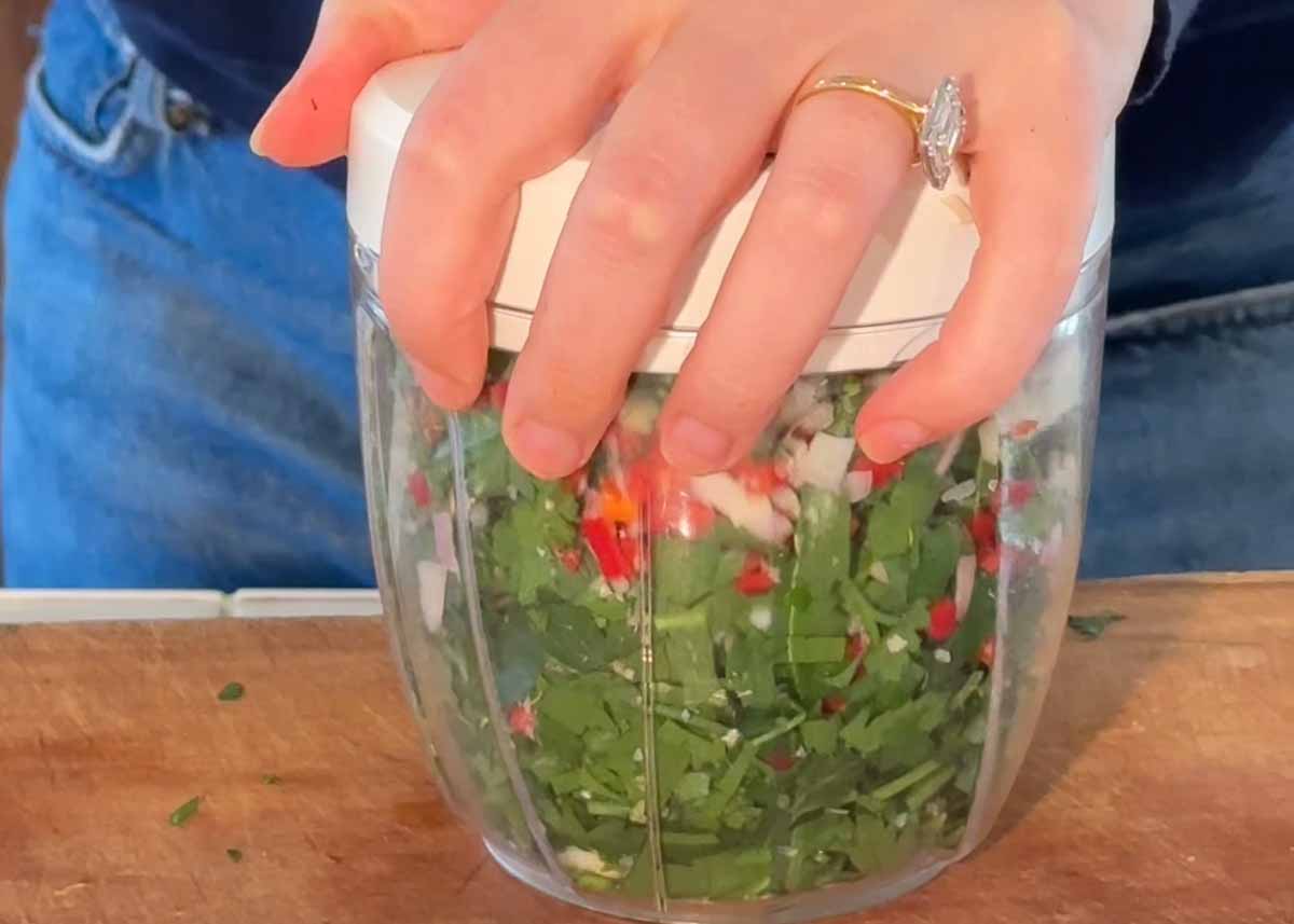 Fresh chimichurri being made with parsley, coriander, garlic and chilli