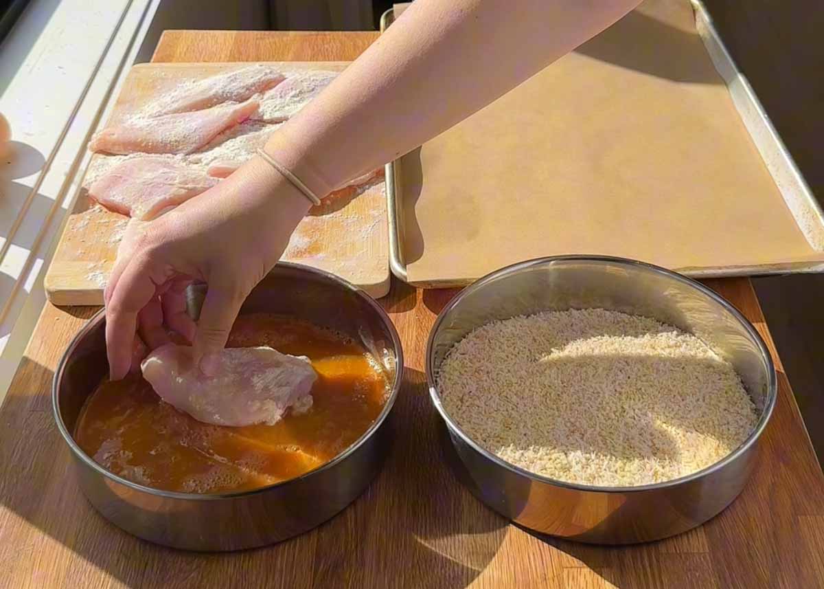 chicken breast going into egg wash