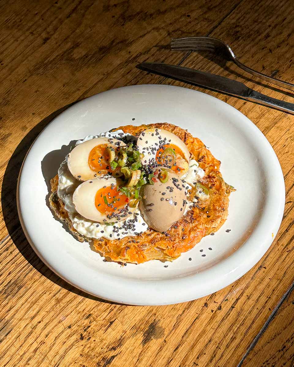 Kimchi pancakes with Korean marinated eggs served with cottage cheese and spring onions