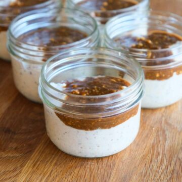 High protein miso caramel bircher muesli in jars topped with glossy caramel swirl