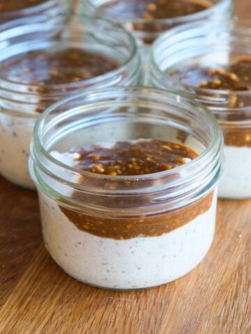 High protein miso caramel bircher muesli in jars topped with glossy caramel swirl