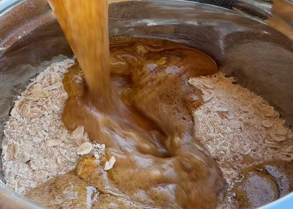 combining brown butter miso mixture into oat coconut biscuit dough