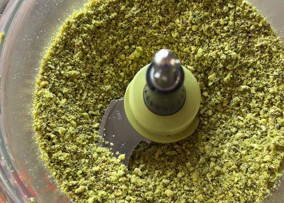 Ground pistachios blended into a coarse meal for pistachio cake.