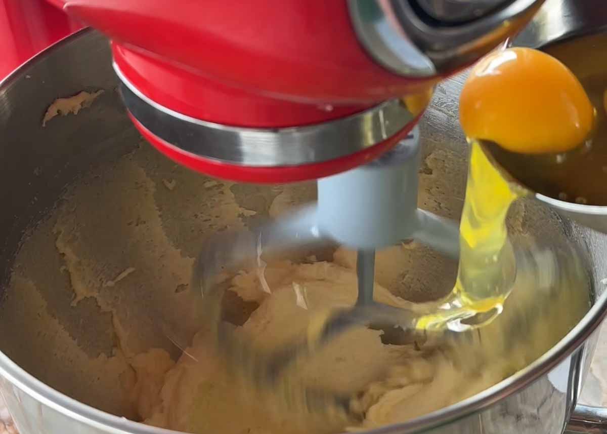Mixing butter, sugar and eggs for spiced pistachio cake batter.