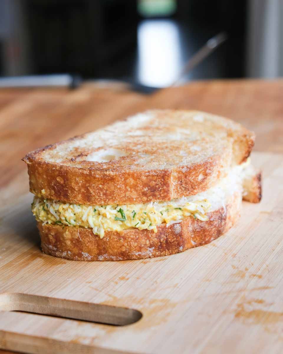 Curried grated egg sandwich assembled and toasted