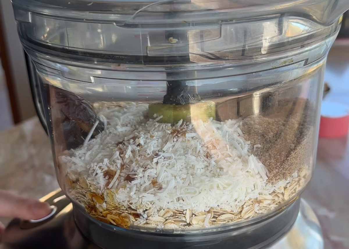 Blending the oat and date base in a food processor.