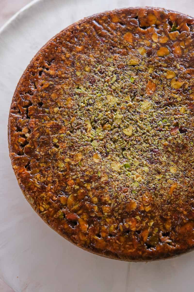 Whole spiced pistachio upside down cake with caramelised pistachio topping.