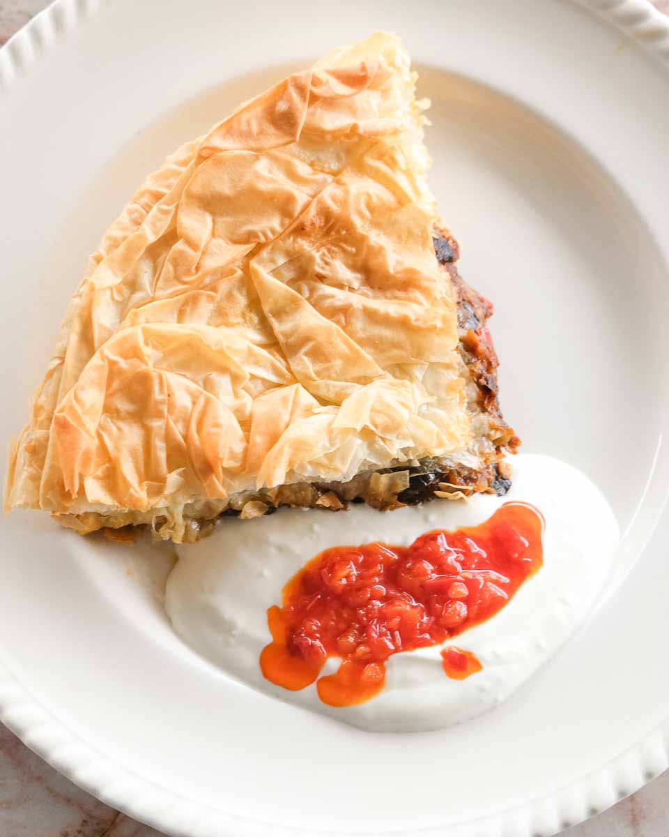 Golden eggplant and capsicum börek served warm with roasted capsicum relish.