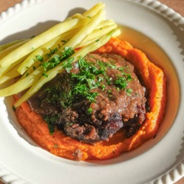 Beef cheeks with carrot purée, green beans and rich red wine sauce