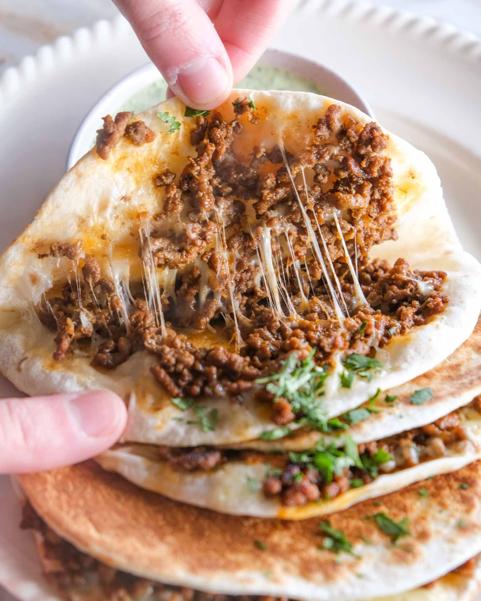 Beef taco with melted Colby cheese and jalapeño coriander yoghurt