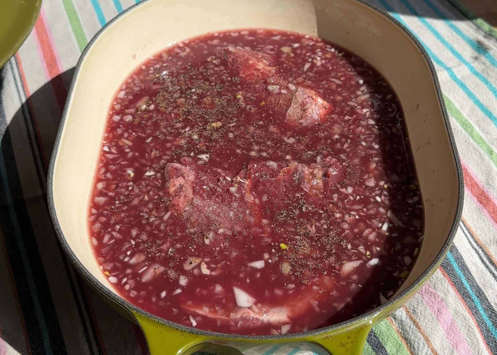 Beef cheeks braising in a red wine and beef stock sauce