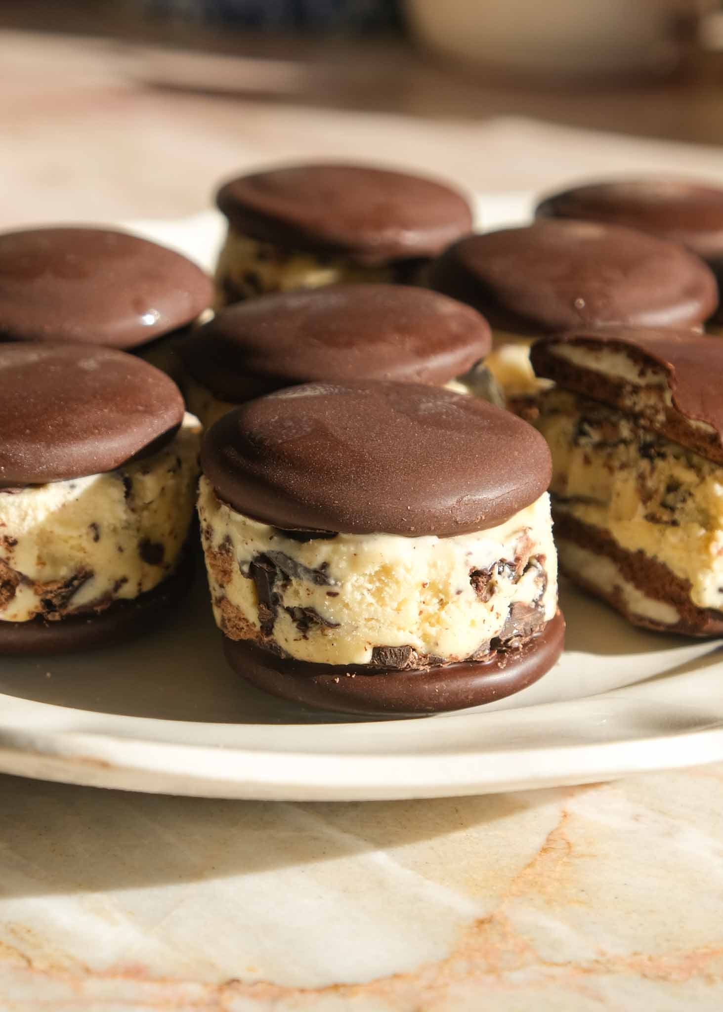 Homemade Mint Slice ice cream sandwiches stacked on a serving plate