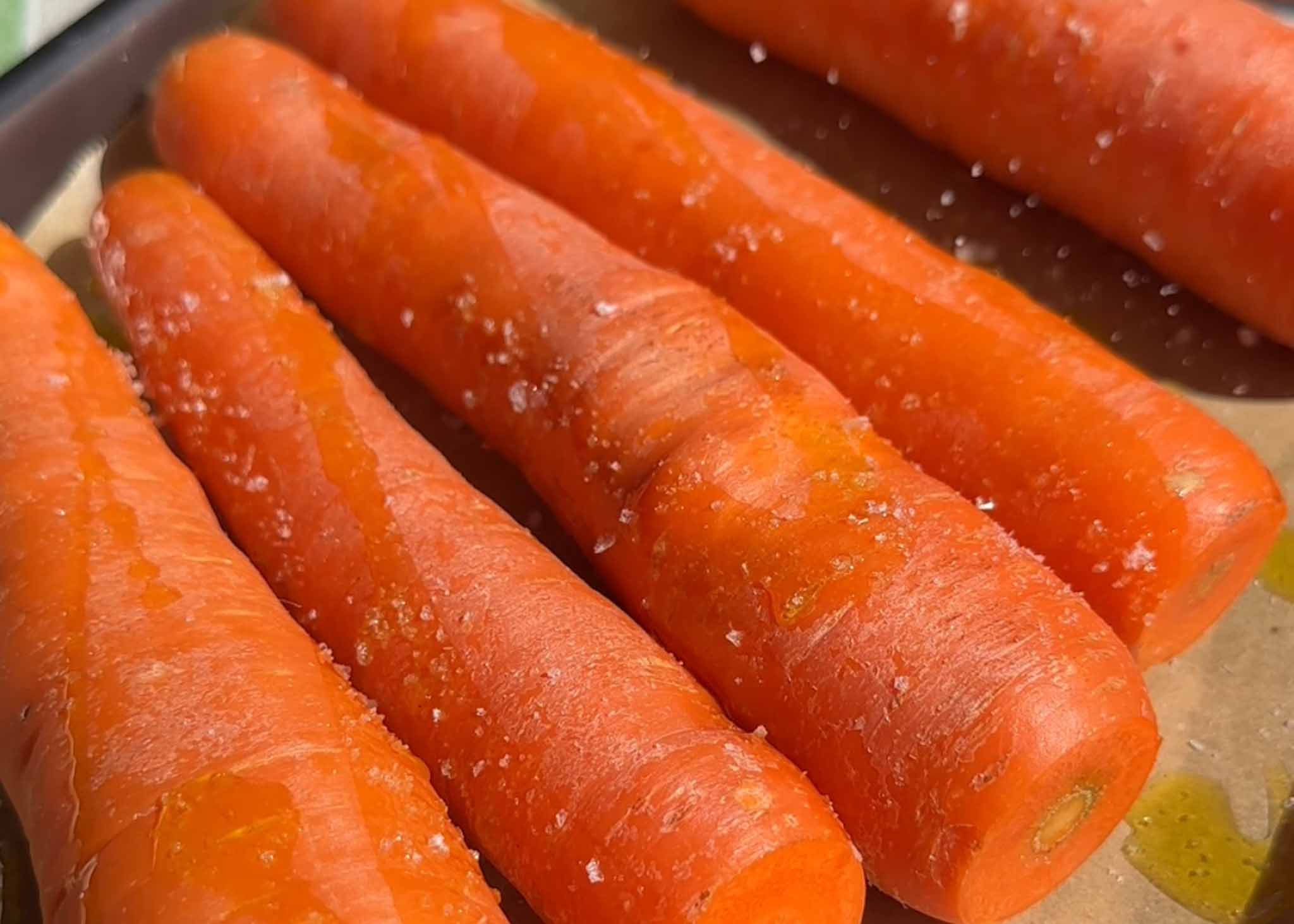 Roasted carrots seasoned and ready to be blended into carrot purée