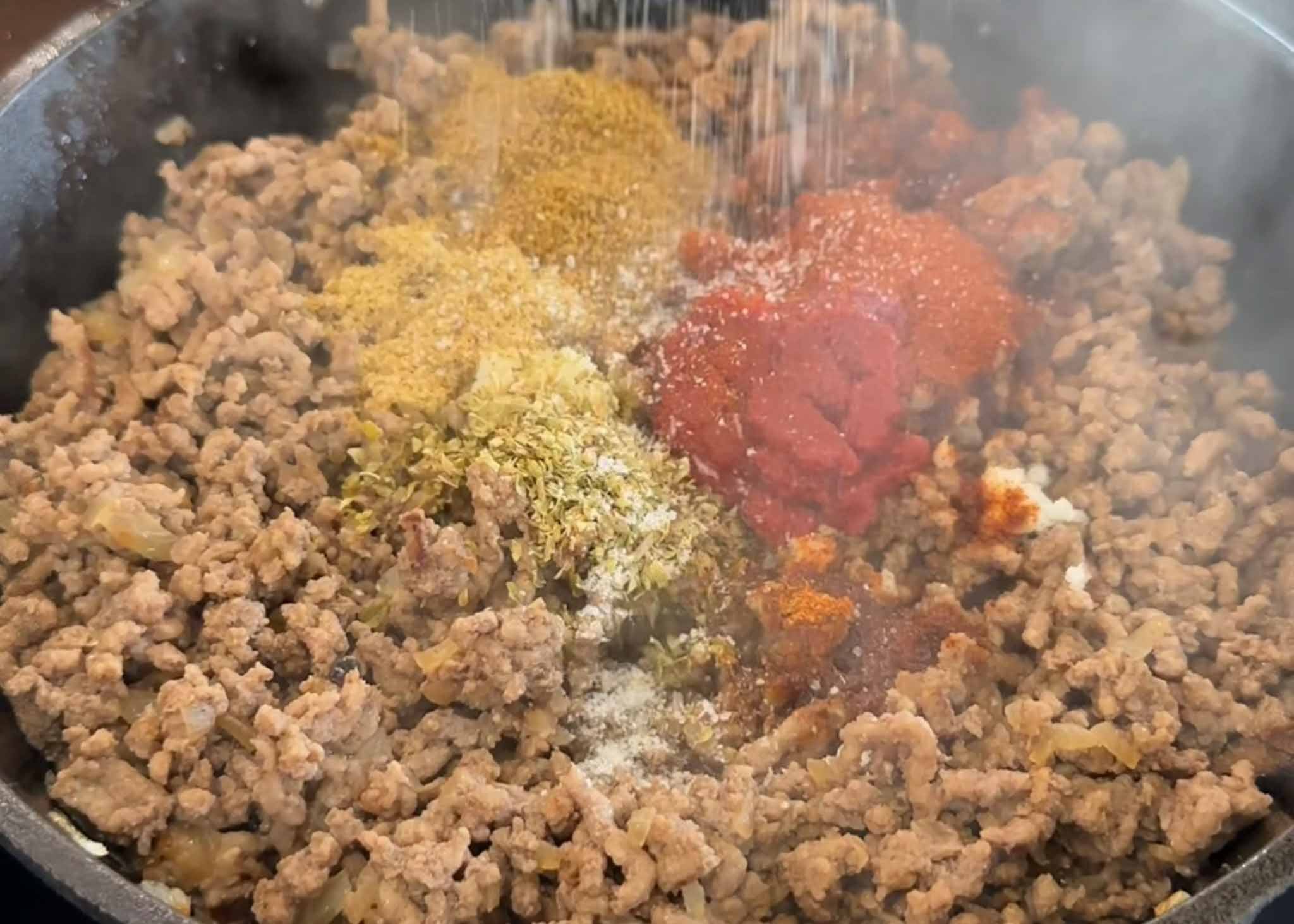 Spiced beef mince cooking in a frying pan for beef tacos